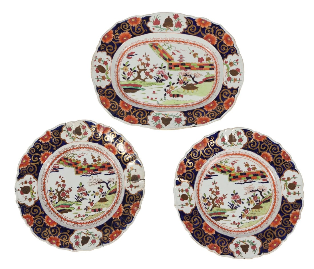 THREE MASONS IRONSTONE POLYCHROME PLATES: Three Mason’s Ironstone plates, each of lobed form, decorated in polychrome enamels with chinoiserie landscapes, pagodas, and floral motifs within cobalt and gilt borders. CERAMICS