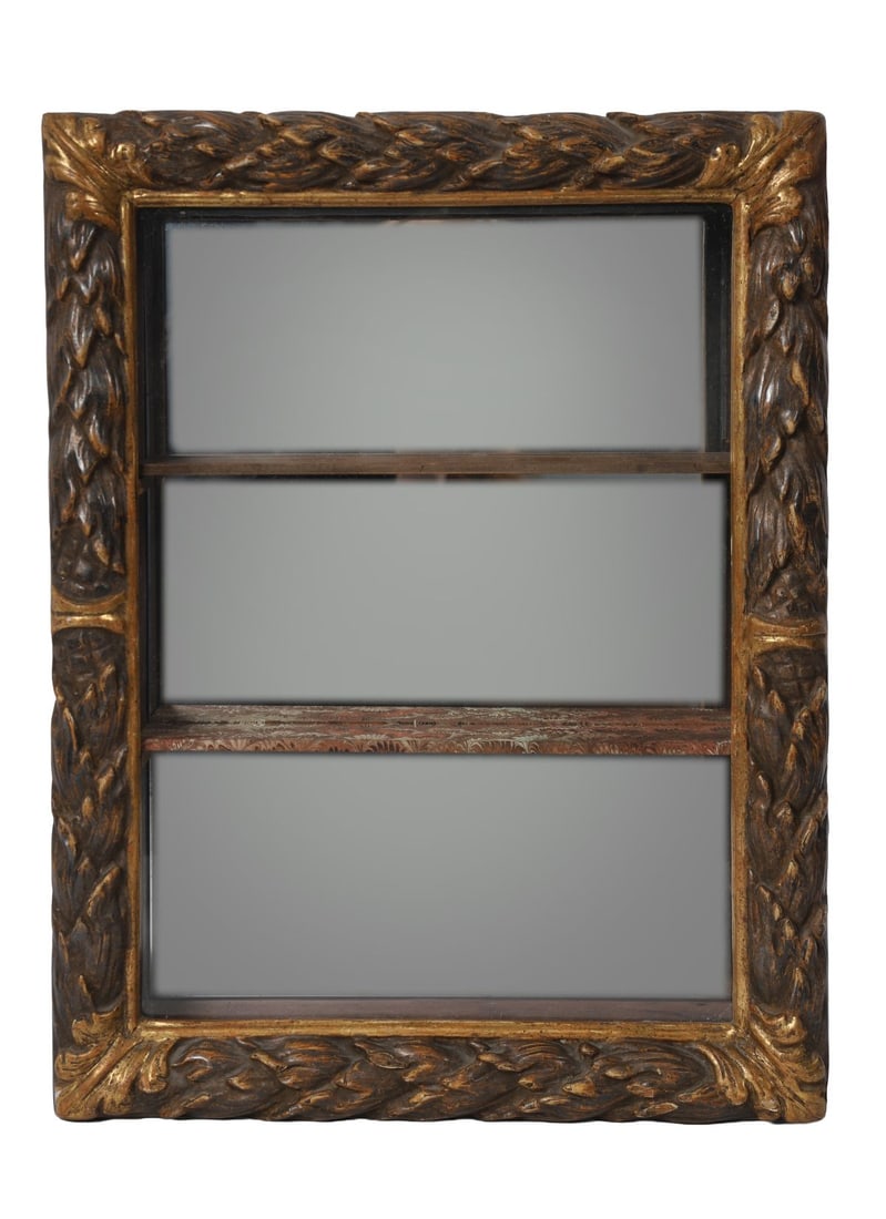 CARVED AND PARCEL GILT WALL DISPLAY CABINET: Rectangular form with glazed door and interior shelving, the frame carved with scrolling foliage. FURNITURE