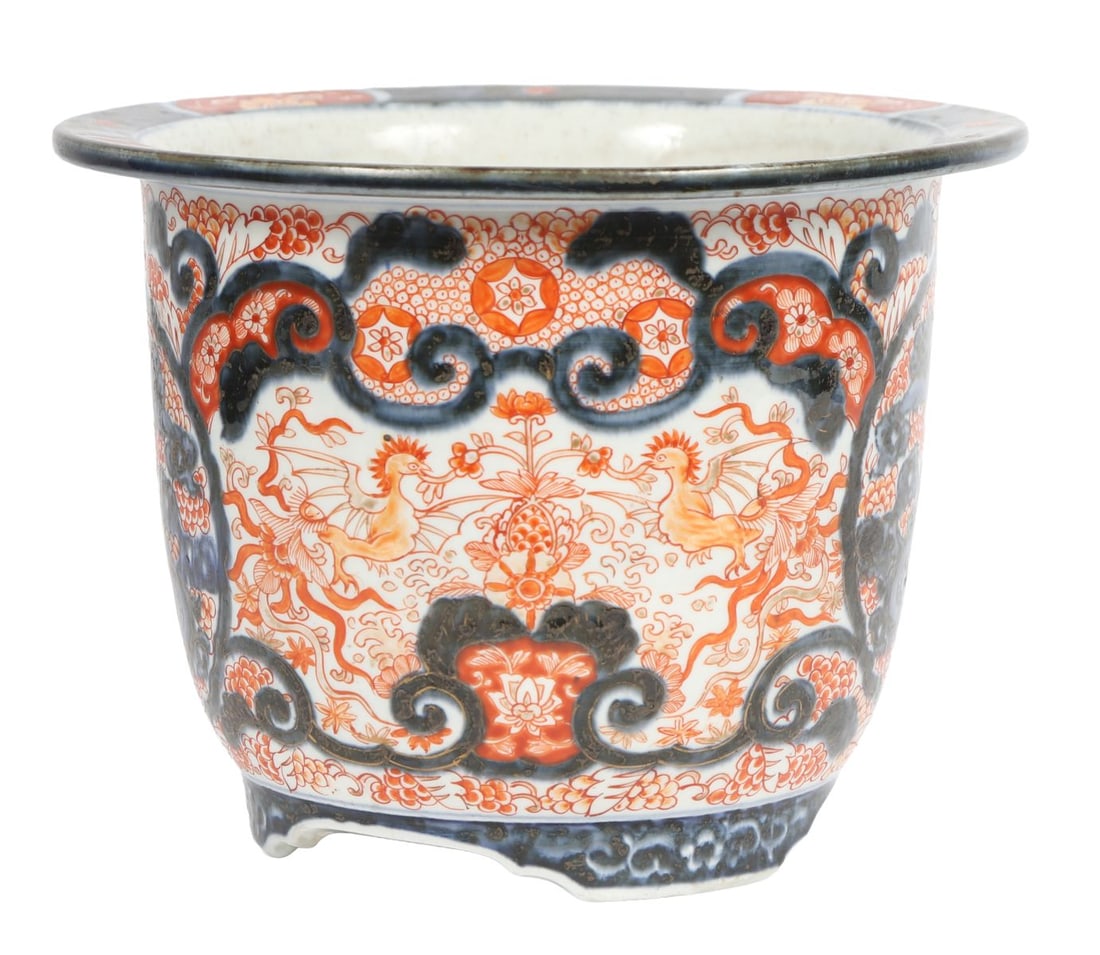 A 19TH CENTURY JAPANESE IMARI DRAGON JARDINIERE: A 19th-century Japanese Imari jardinière, of circular form, decorated with a central dragon motif within dense floral and foliate ornament in iron-red, cobalt blue and gilt. JAPANESE