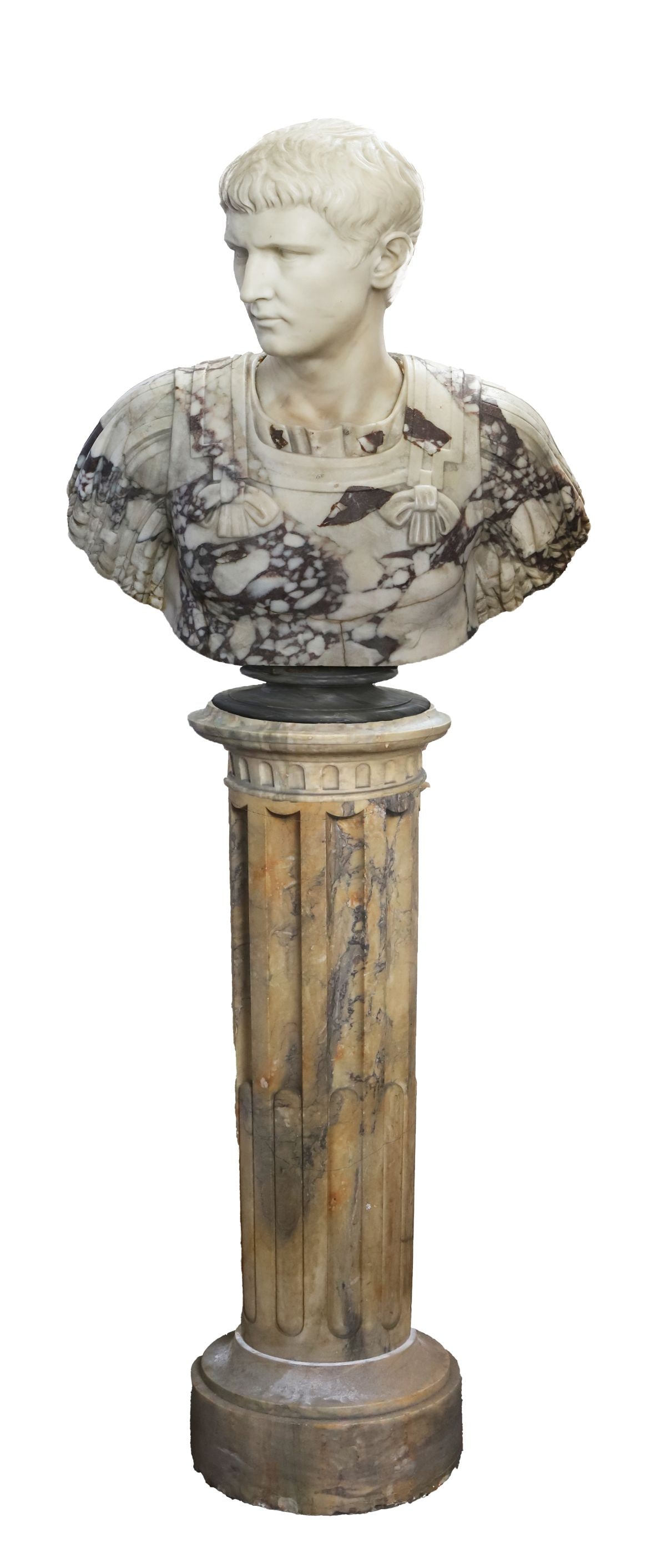 18TH - CENTURY GRAND TOUR MARBLE BUST OF CALIGULA: the shoulders draped, the head finely modelled and raised on a socle base, the marble of variegated tone, mounted on a tall fluted column. SCULPTURE