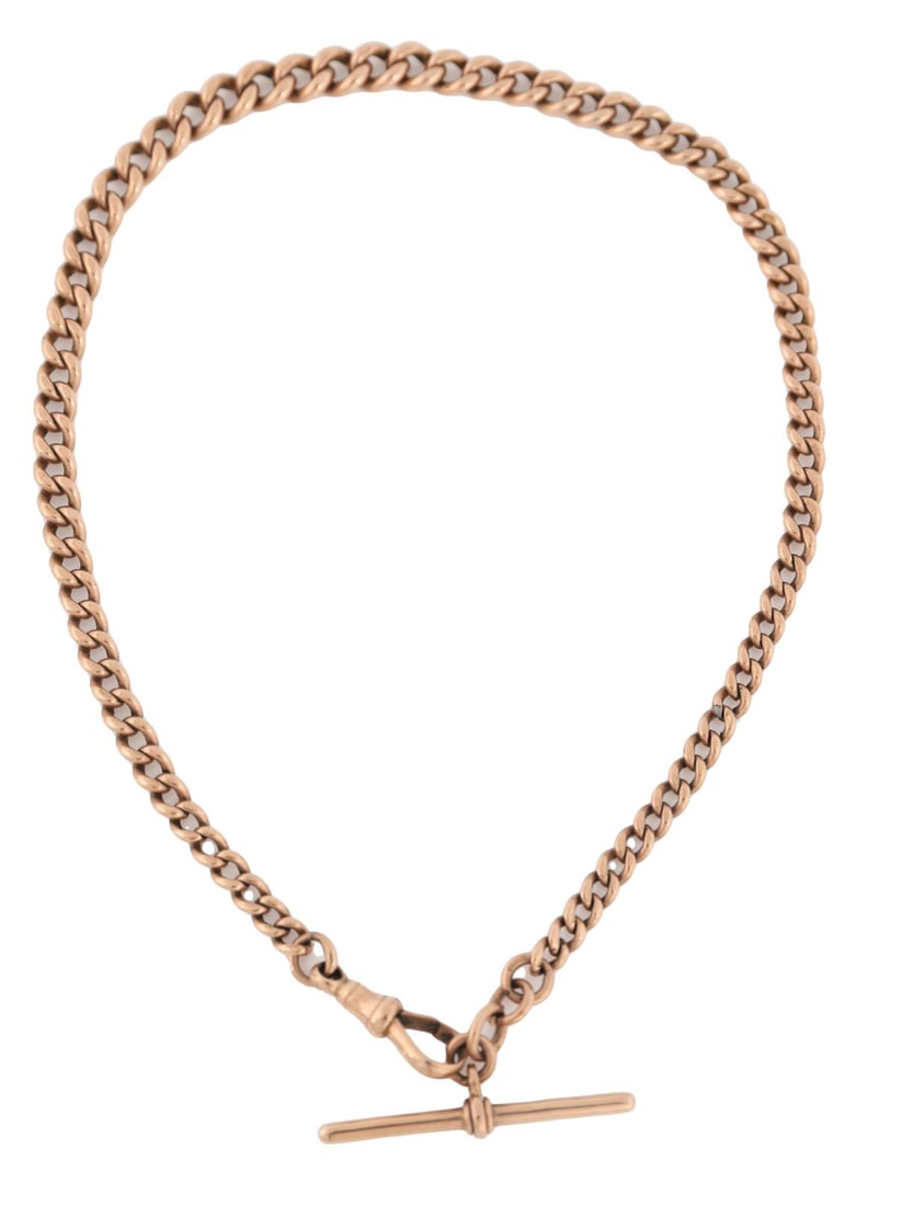 9 CT. GOLD ALBERT WATCH CHAIN WITH T-BAR: A gold curb-link Albert watch chain, formed of graduated curb links and fitted with a swivel clasp and T-bar suspension. 31 grams. JEWELLERY