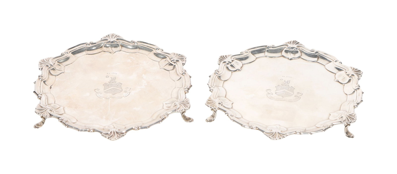 PR SILVER CARD TRAYS: ENGRAVED WITH THE ARMS OF THE WORSHIPFUL COMPANY OF BLACKSMITHS, LONDON A pair of silver card trays, each of shaped circular form, engraved with the arms of the Worshipful Company of Blacksmiths,