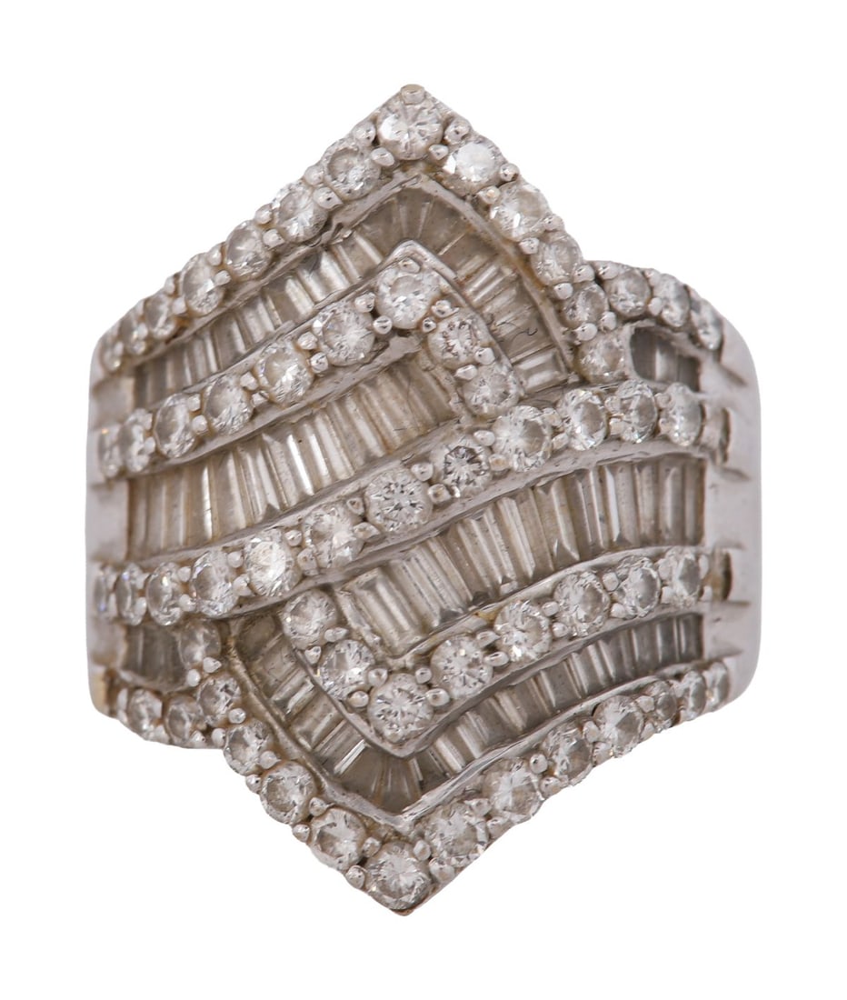 18CT WHITE GOLD DIAMOND CLUSTER RING: Of tiered architectural design, set throughout with baguette and round brilliant-cut diamonds in multiple rows, the broad head of stepped form, on a tapering shank. JEWELLERY