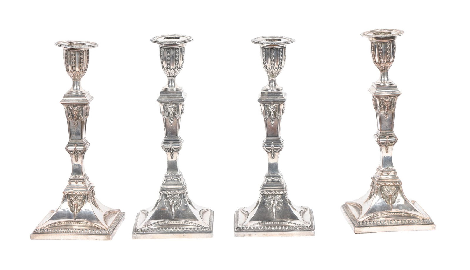 SET OF 4 GEORGE III SHEFFIELD-PLATED CANDLESTICKS: Each with knopped stem and square base, in the neoclassical manner. SILVER AND SILVER PLATE