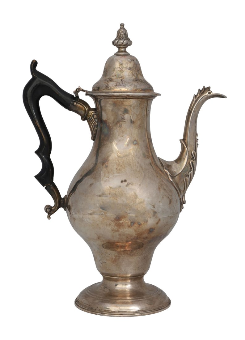 18TH-CENTURY IRISH STERLING SILVER COFFEE POT: By Carden Terry, Cork.Of baluster form, the domed hinged cover surmounted by a finial, with a scroll spout and carved wooden handle, raised on a circular spreading foot. Fully marked for Cork and by C