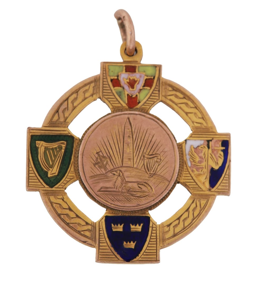 NATIONAL HURLING LEAGUE DIVISION I WINNER’S MEDAL: TIPPERARY, 1927, 9 ct. gold Celtic Cross-form medal by John Miller, Dublin, with enamelled provincial shields and central roundel depicting round tower and hurling motifs, the reverse engraved