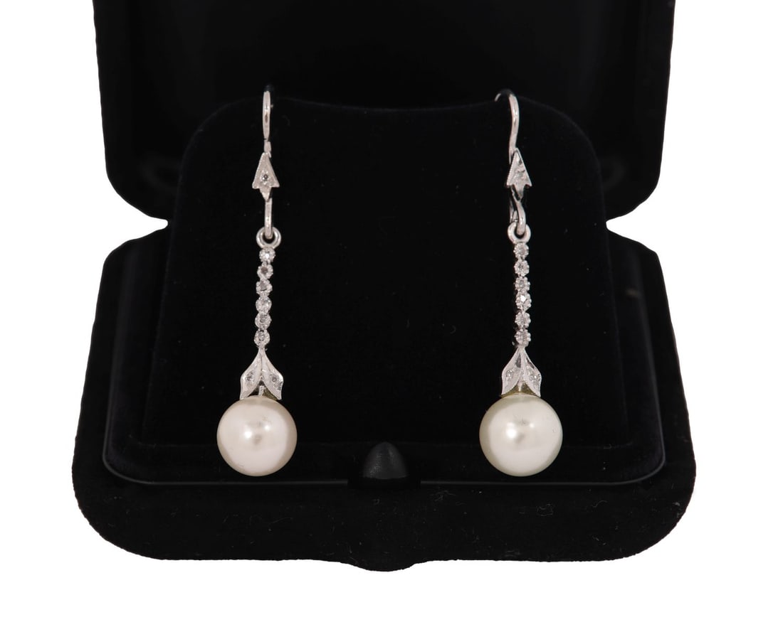 PAIR OF CULTURED PEARL AND DIAMOND DROP EARRINGS: A pair of cultured pearl and diamond drop earrings. JEWELLERY
