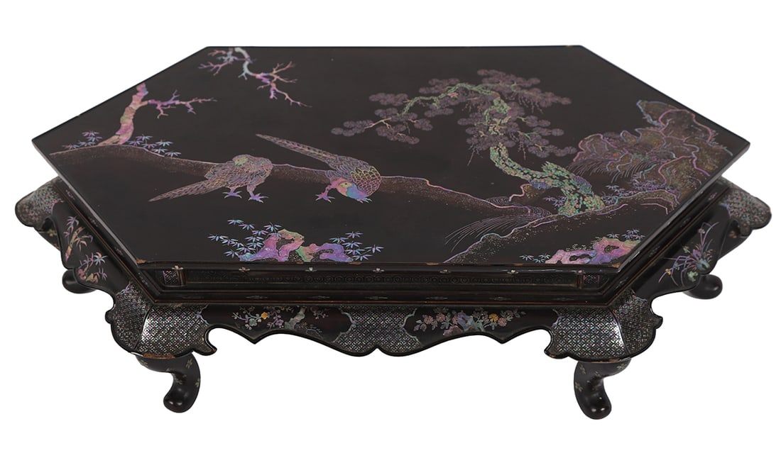 CHINESE KANGXI LACQUERED SCHOLAR’S TABLE: A Chinese Kangxi period lacquered scholar’s table, the rectangular top decorated with mother-of-pearl inlay of birds and flowering branches, raised on shaped legs with carved apron.19 cm. high; 70 c