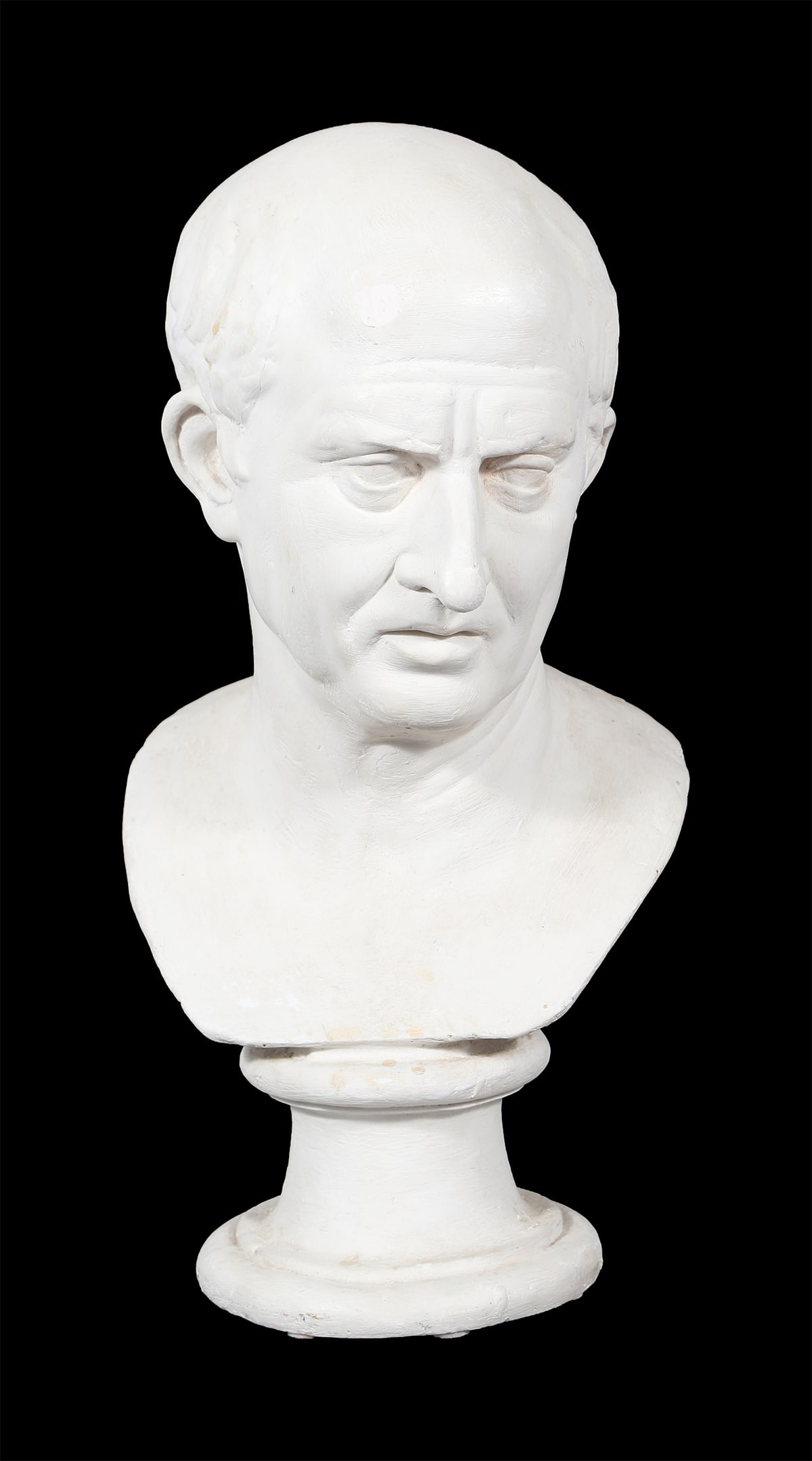 PLASTER BUST OF A ROMAN EMPEROR: A companion plaster bust of a Roman emperor, after the antique.56 cm. high; 25 cm. wide; 28 cm. deep