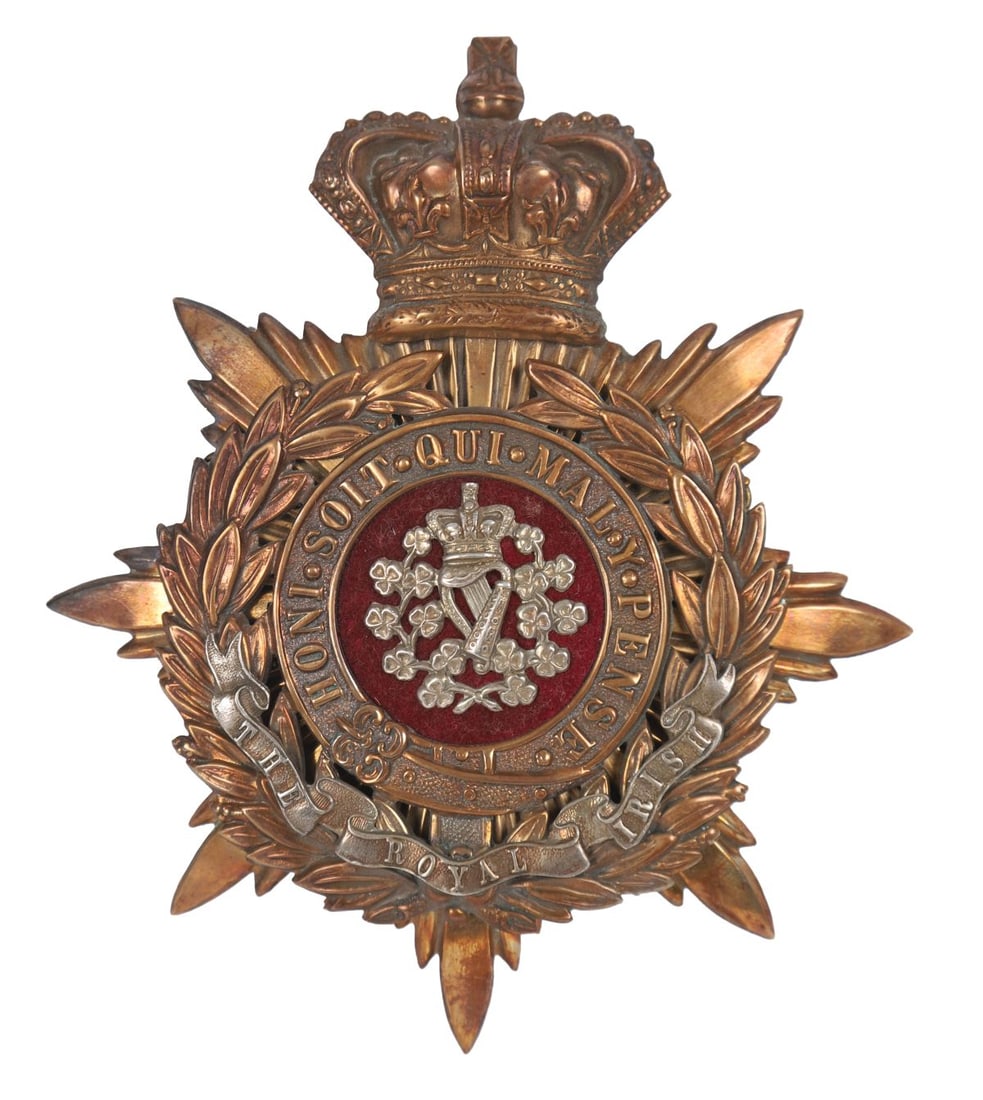 ROYAL IRISH REGIMENT OFFICER’S HELMET PLATE: KING’S CROWN, A Royal Irish Regiment officer’s helmet plate, mounted with King’s crown above regimental device. MILITARIA