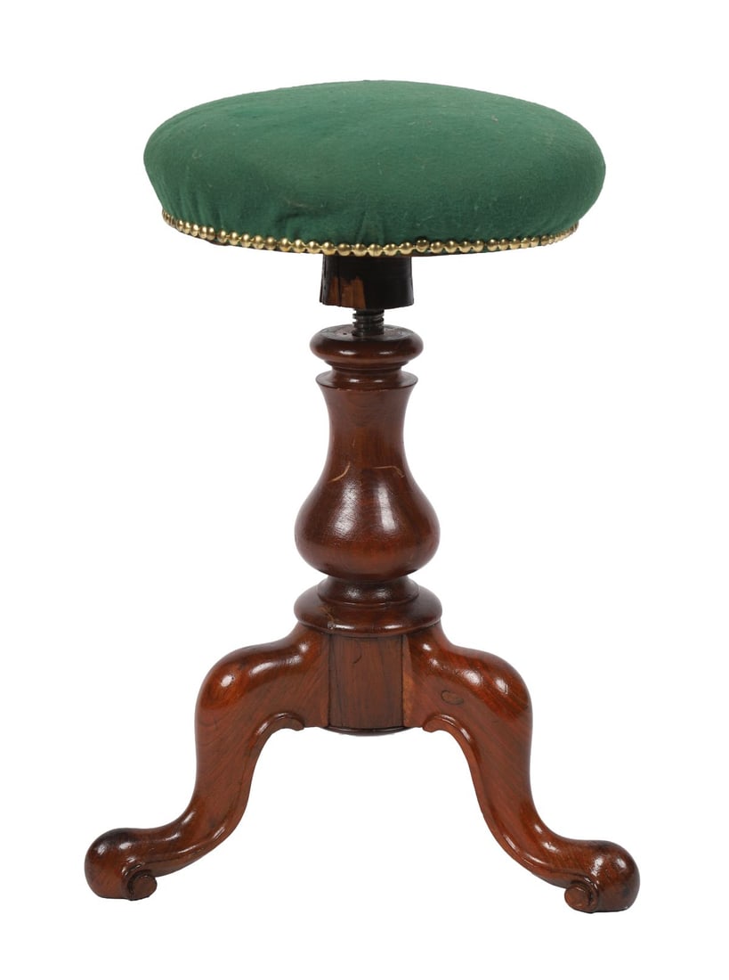 EARLY VICTORIAN MAHOGANY REVOLVING PIANO STOOL: An early Victorian mahogany piano stool with circular seat, raised on a turned column and tripod cabriole base, adjustable by screw mechanism. FURNITURE
