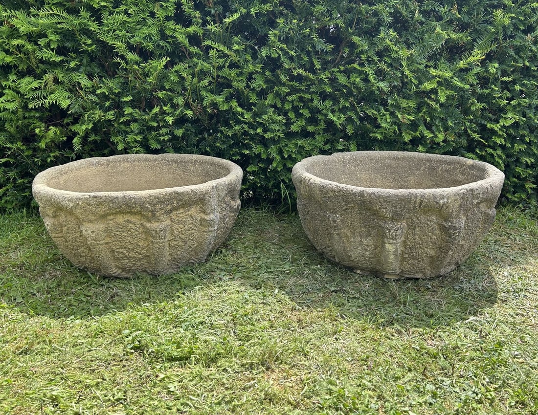 PR OF MEDIEVAL STYLE COMPOSITE STONE GARDEN URNS: Pair Composite stone garden urns of circular tapering form with relief decoration to the body and weathered surface patination.