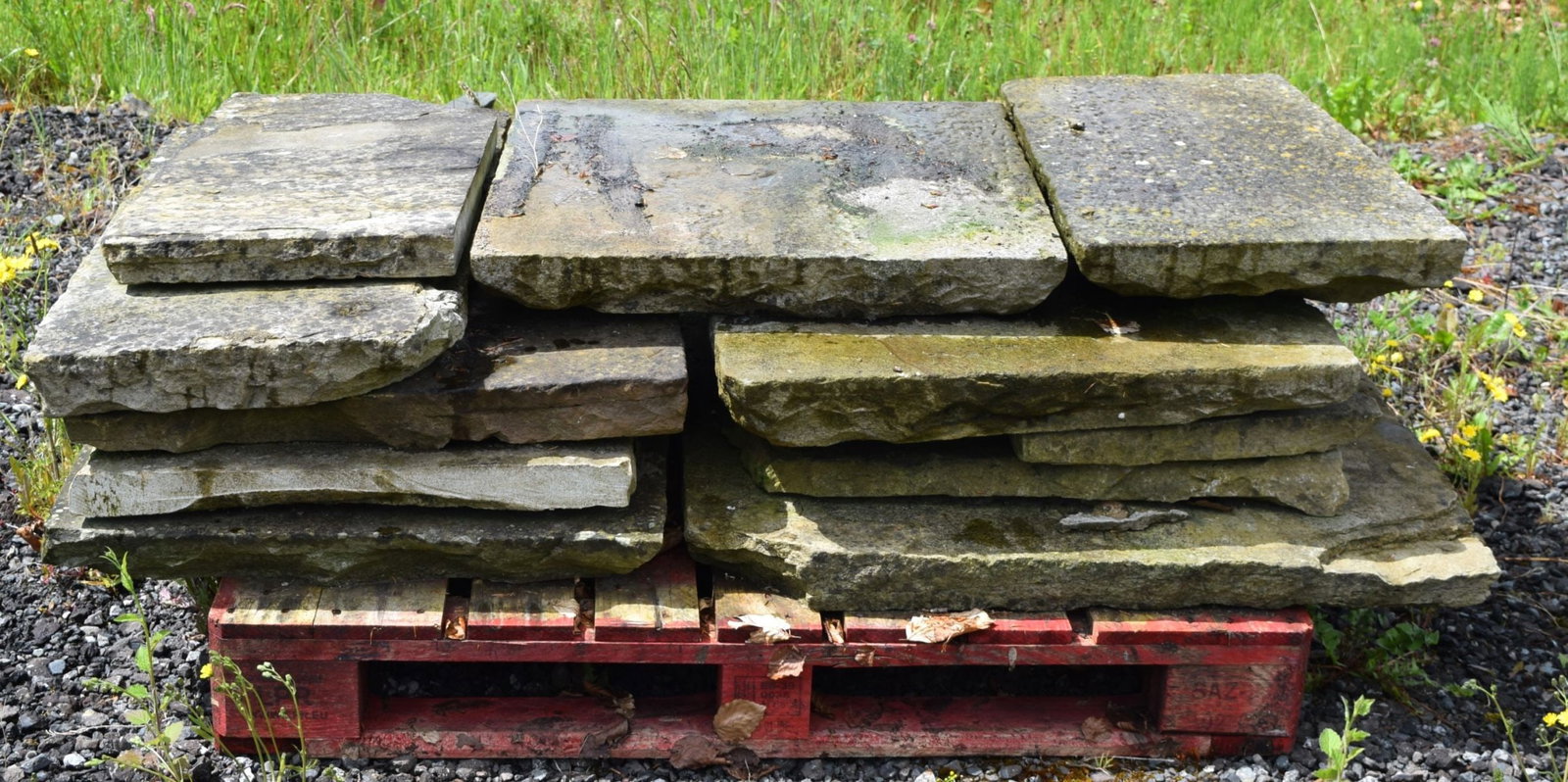 LOT OF 11 STONE PAVING SLABS: Collection of reclaimed stone paving slabs of rectangular form.