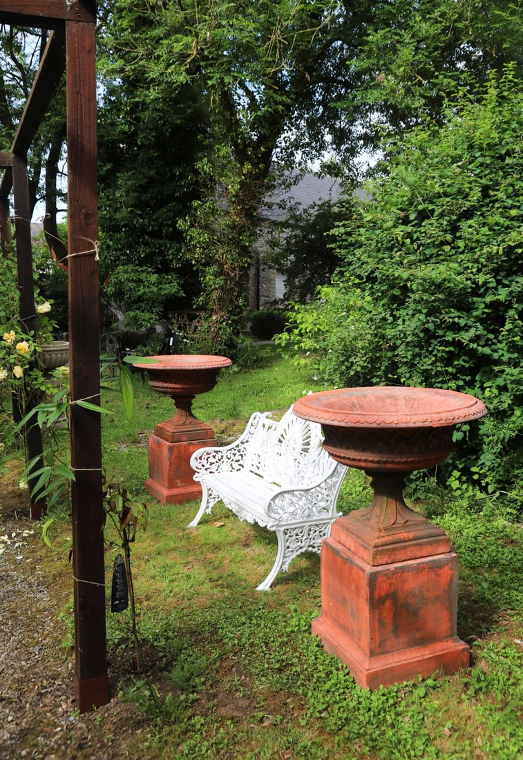 PAIR OF LARGE CLASSICAL TERRACOTTA URNS ON STANDS (1 of 3)