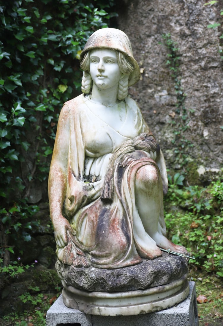 LARGE CLASSICAL GARDEN SCULPTURE: Italianate stone, After Pietro Bazzanti (Italian, 1825?1895)Figure of Ruth modelled as the kneeling Biblical heroine gleaning wheat.