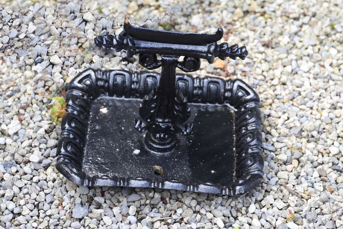 CAST IRON FOOT SCRAPER: Decorative cast iron foot scraper with moulded rope-twist border and integral scraper.