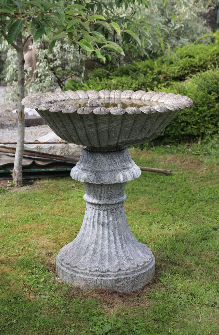 CLASSICAL MARBLE GARDEN BIRDBATH: of flower head form raised on a splayed and fluted turned stem and circular petal foot.
