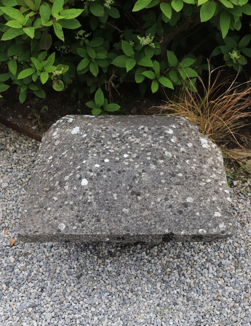 19TH-CENTURY LIMESTONE PIER CAP: Substantial 19th-century carved limestone pier cap of pyramidal form with moulded shoulders and weathered lichen-covered surface.