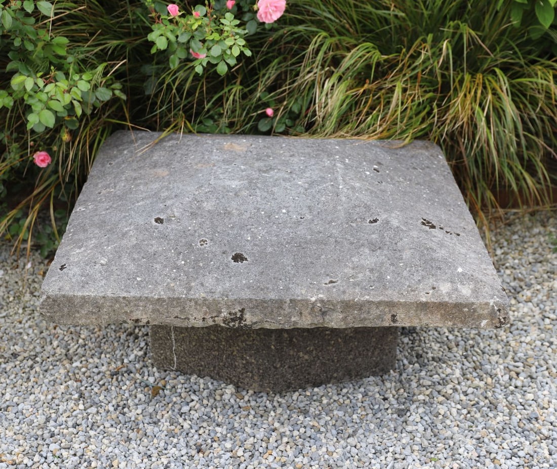 19TH-CENTURY LIMESTONE PIER CAP: Large carved limestone pier cap of square form, the moulded top rising to a low pyramidal profile with rounded corners and a well-weathered surface patina.