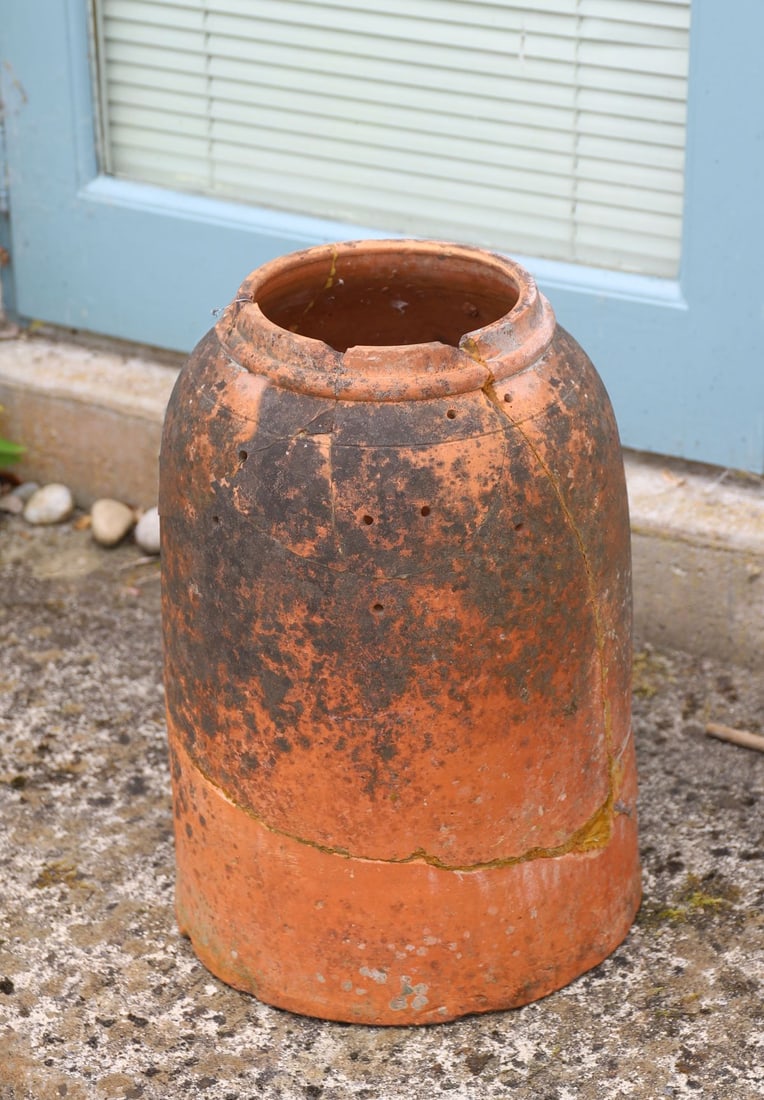 TERRACOTTA RHUBARB FORCER: Traditional terracotta rhubarb forcer of tapering cylindrical form with removable cover. Weathered surface.