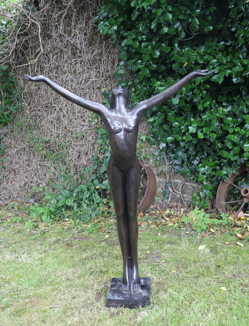 LARGE BRONZE GARDEN SCULPTURE: figure of a female nude with her arms outstretched.