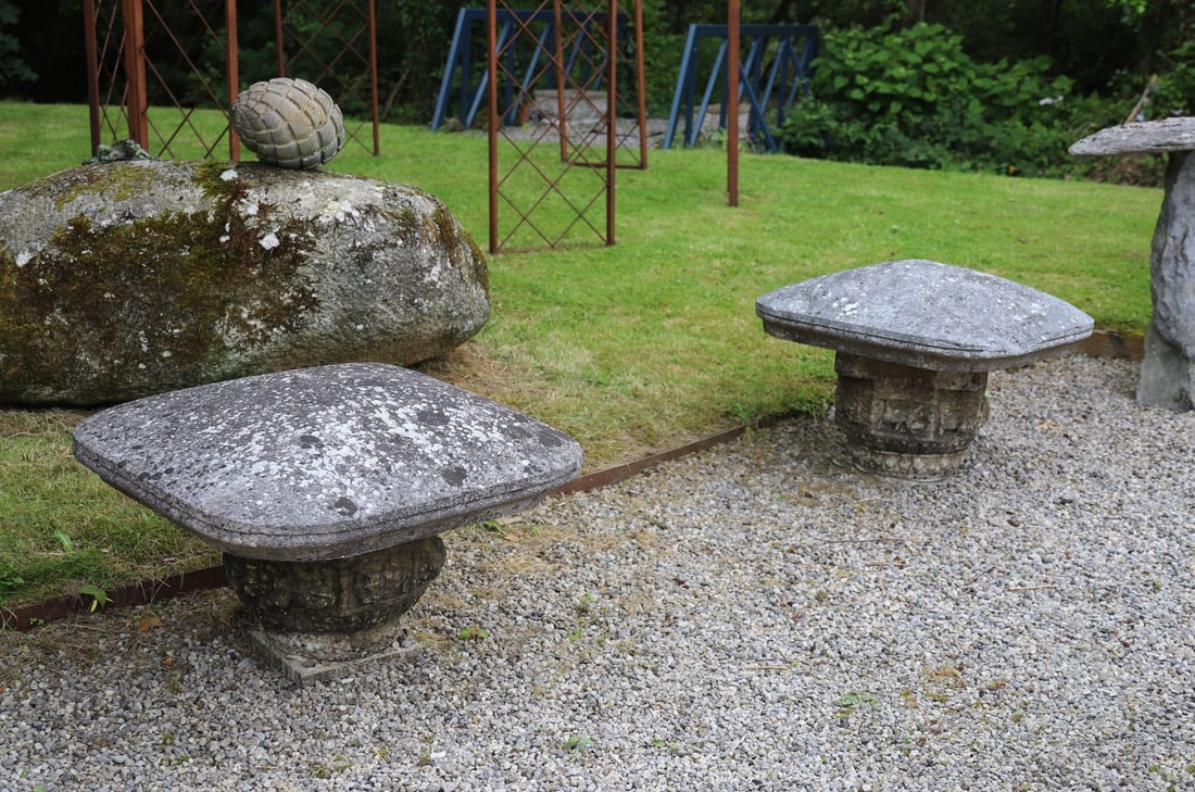 PAIR OF 19TH-CENTURY LIMESTONE PIER CAPS: Pair of rounded rectangular limestone pier caps with weathered surface and natural lichen patination.