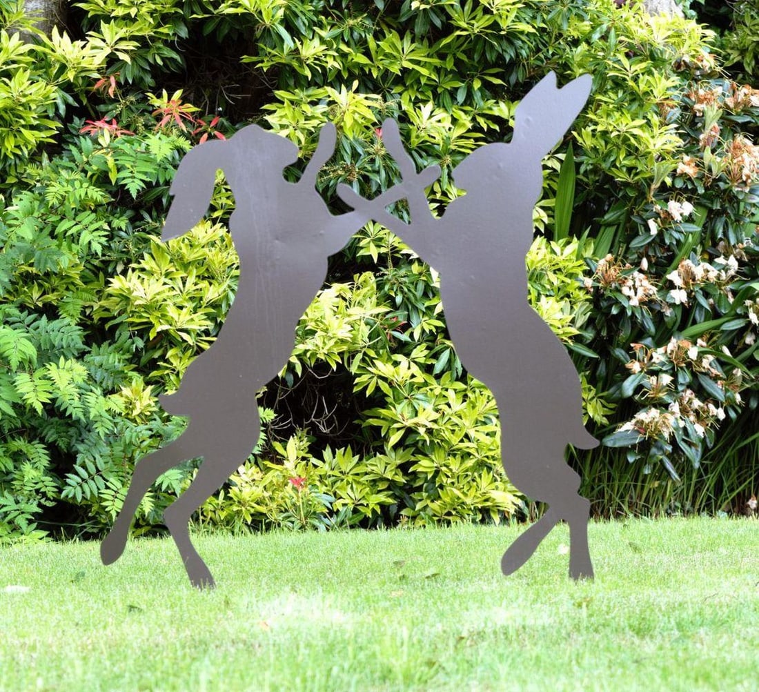 METAL SILHOUETTE CUT-OUT: of two boxing hares.