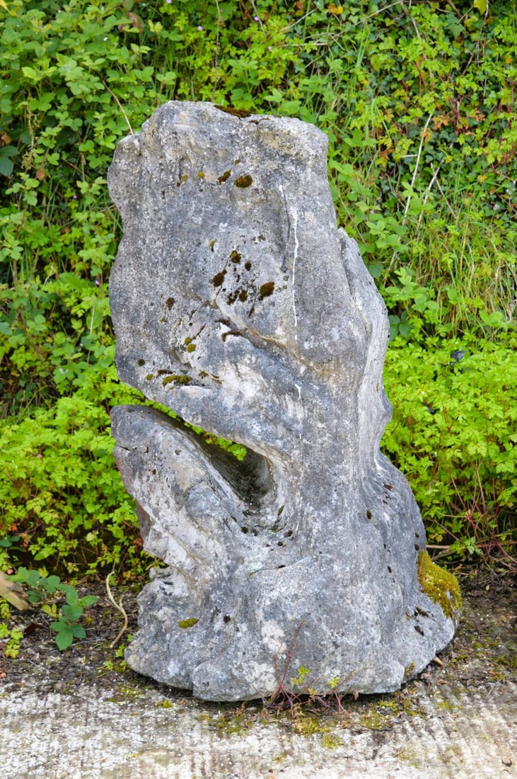 LARGE DECORATIVE SCULPTURAL STONE GARDEN FEATURE: An abstract sculptural stone form of significant scale, carved from solid stone with sweeping curves. Contemporary garden centrepiece.