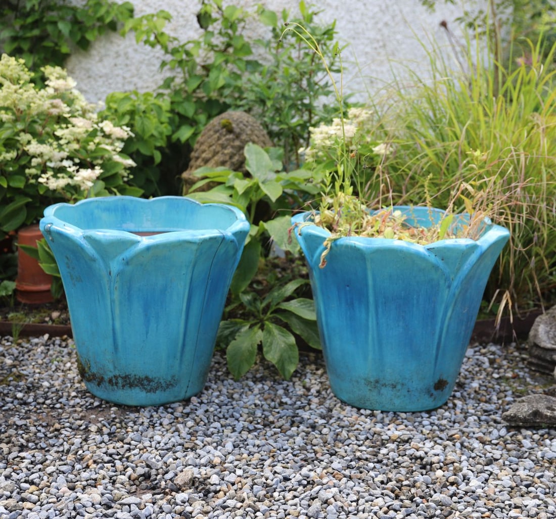 PR TURQUOISE GLAZED TERRACOTTA PLANTERS: ART DECO-STYLE, Pair of large turquoise glazed terracotta planters of tapering octagonal form, the scalloped rims with angular lobed corners and moulded vertical panels, displaying a vibrant blue-gree