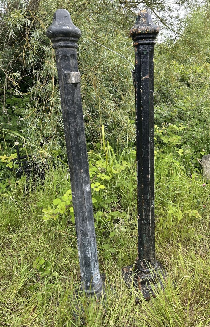LATE 19TH-CENTURY DUBLIN CAST IRON GATE POSTS: BY KENNAN & SONS Pair of cast iron gate posts of tapering octagonal form with domed finials and moulded bases, one bearing the foundry mark ?Kennan & Sons Ltd, Dublin?. Manufactured by the Fishamble S