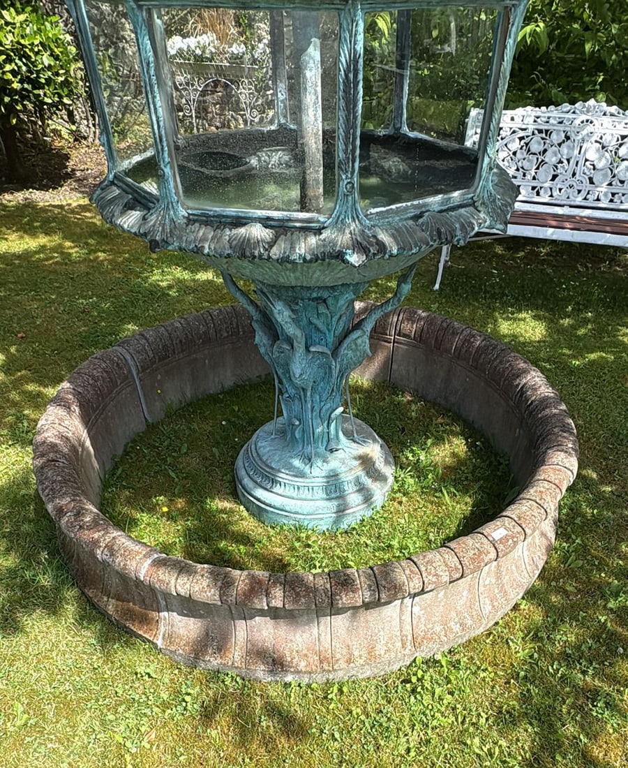 LARGE MOULDED STONE POOL SURROUND: with ribbed scroll decoration. 110 cm. diameter (approx.)
