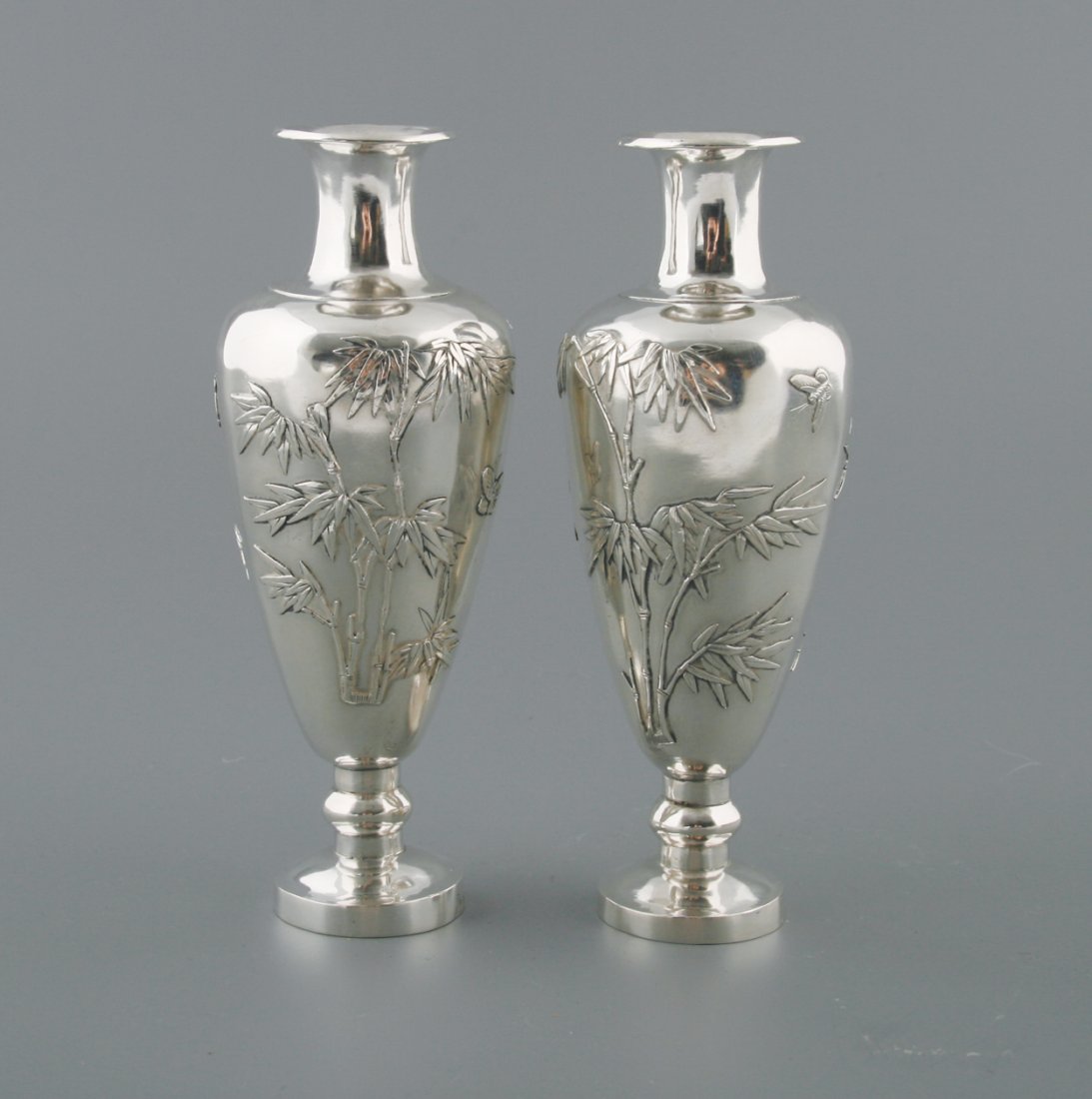 Pair Japanese silver vases: Pair Japanese silver vases Each 16 cm. high