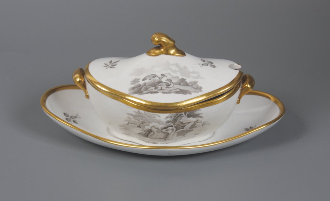 Early nineteenth-century Spode parcel gilt tureen and: Early nineteenth-century Spode parcel gilt tureen and cover on an oval plate 16 cm. wide