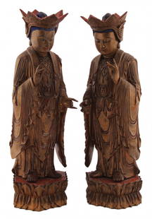 Pair of Chinese Qing period carved giltwood and: Pair of Chinese Qing period carved giltwood and polychrome Buddhas each standing on a lotus cushion 43 cm. high