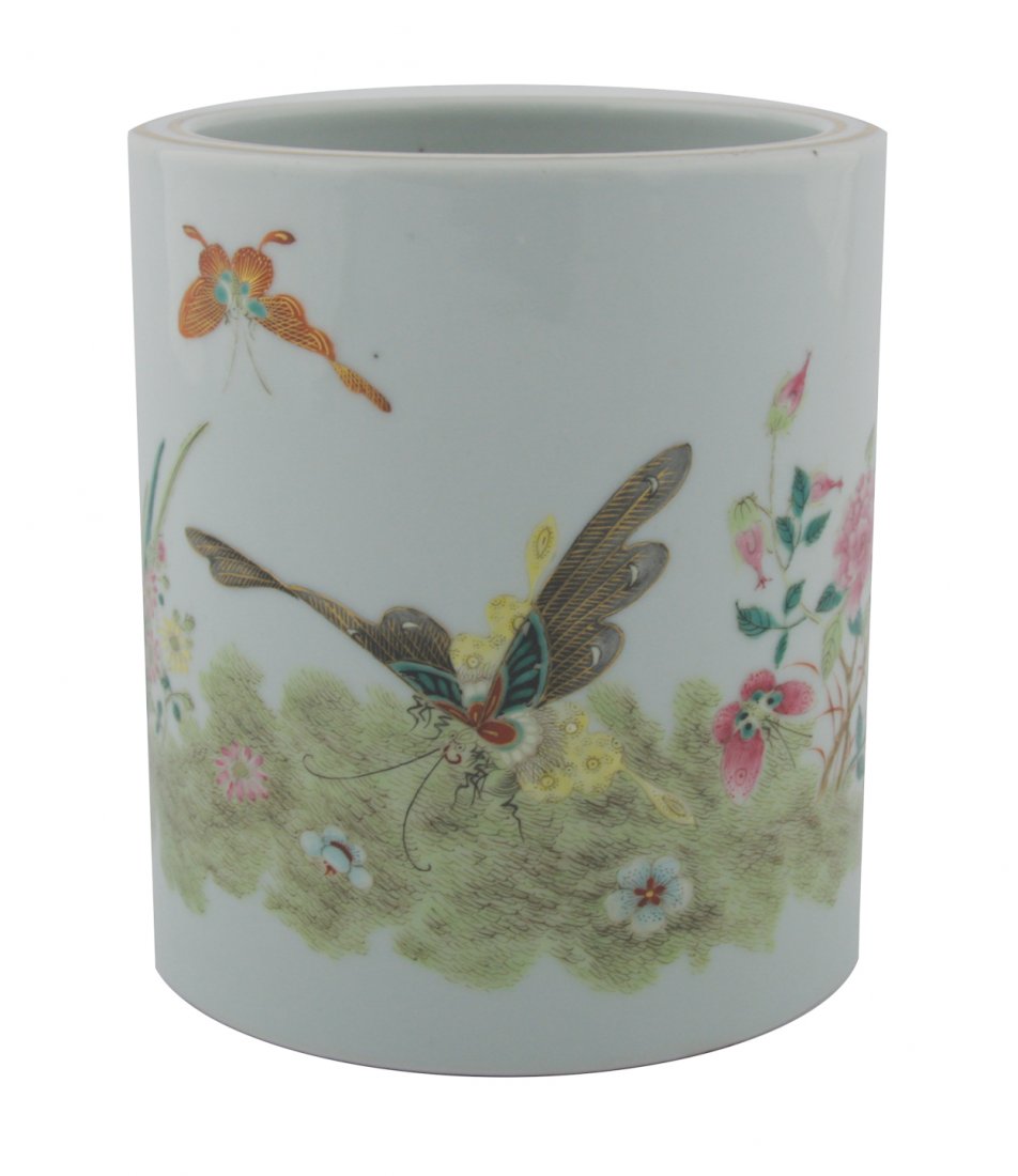 Chinese Guanxu period famille rose brush pot: Chinese Guanxu period famille rose brush pot decorated with butterflies, grass hopper and peony, six character mark to base in underglaze blue,with enamelled border, amongst scrolling dragons 14.8 cm.