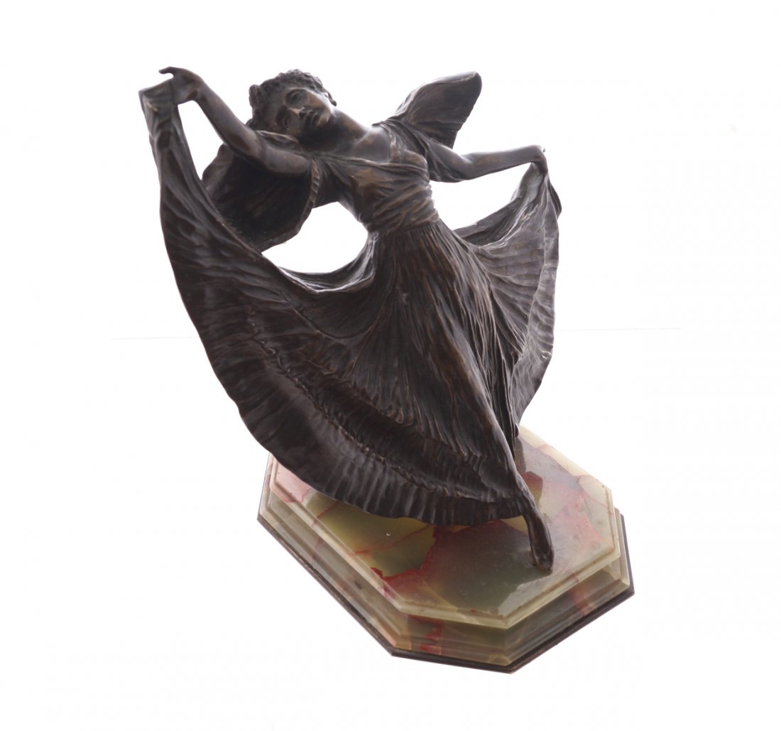 Art Deco period bronze: Art Deco period bronze of a dancing girl with long flowing dress, raised on a moulded alabaster base Worldwide shipping available on all items. Direct inquiries to shipping@sheppards.ie 24 cm. high