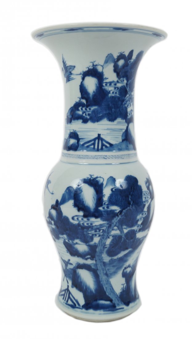 A blue and white Chinese ‘phoenix tail’ vase, Kangxi: The spreading foot rising to a rounded body and tall cylindrical neck with flared rim, richly painted in deep tones of cobalt blue with two deer in a landscape of pine trees, mountain peaks and water,