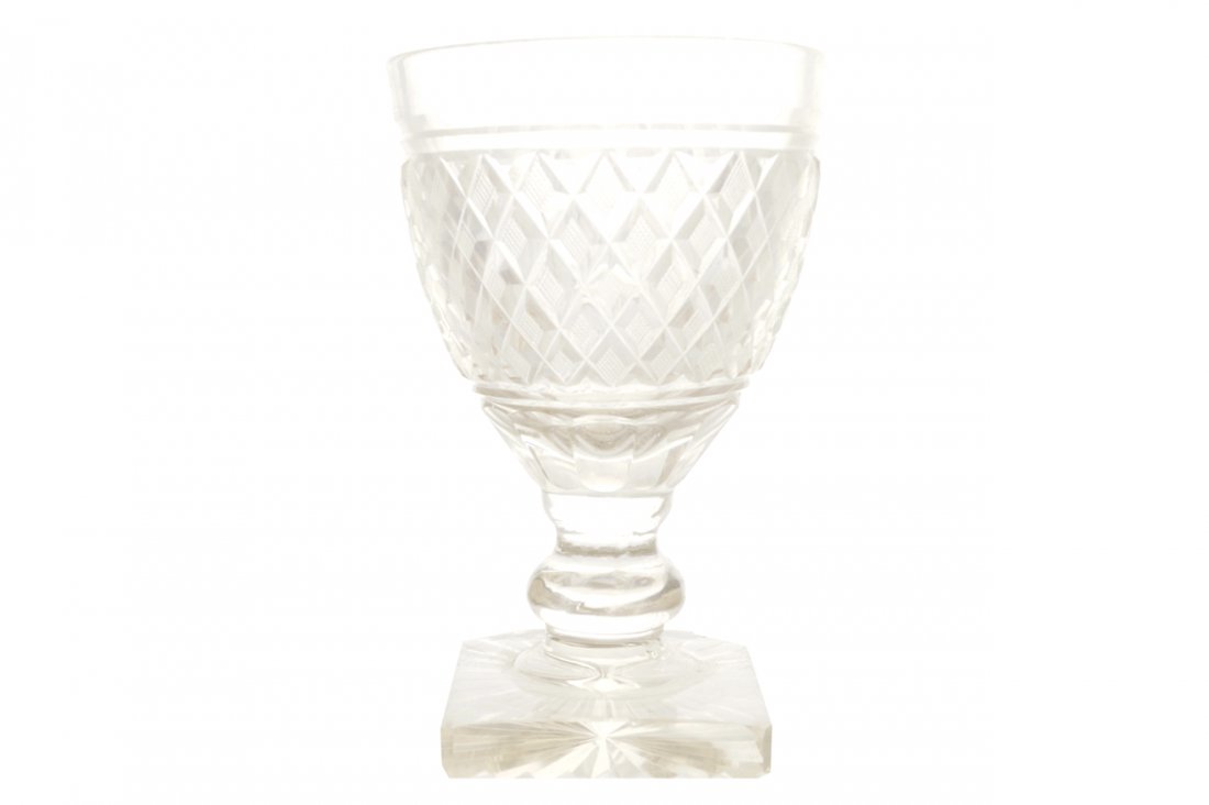 EARLY NINETEENTH-CENTURY IRISH PENROSE GLASS CHALICE: EARLY NINETEENTH-CENTURY IRISH PENROSE GLASS CHALICE SHAPED VASE the body decorated with raised beaded trellis panels, supported on a turned stem and square foot Direct all shipping enquiries to shipp
