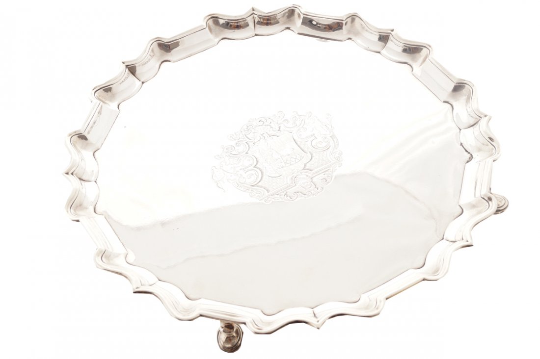 George II circular salver: George II circular salver with pie crust rim, and engraved armorial cartouche, raised on pad feet, London 1731. Maker probably James Smith Worldwide shipping available. All queries must be made to shi