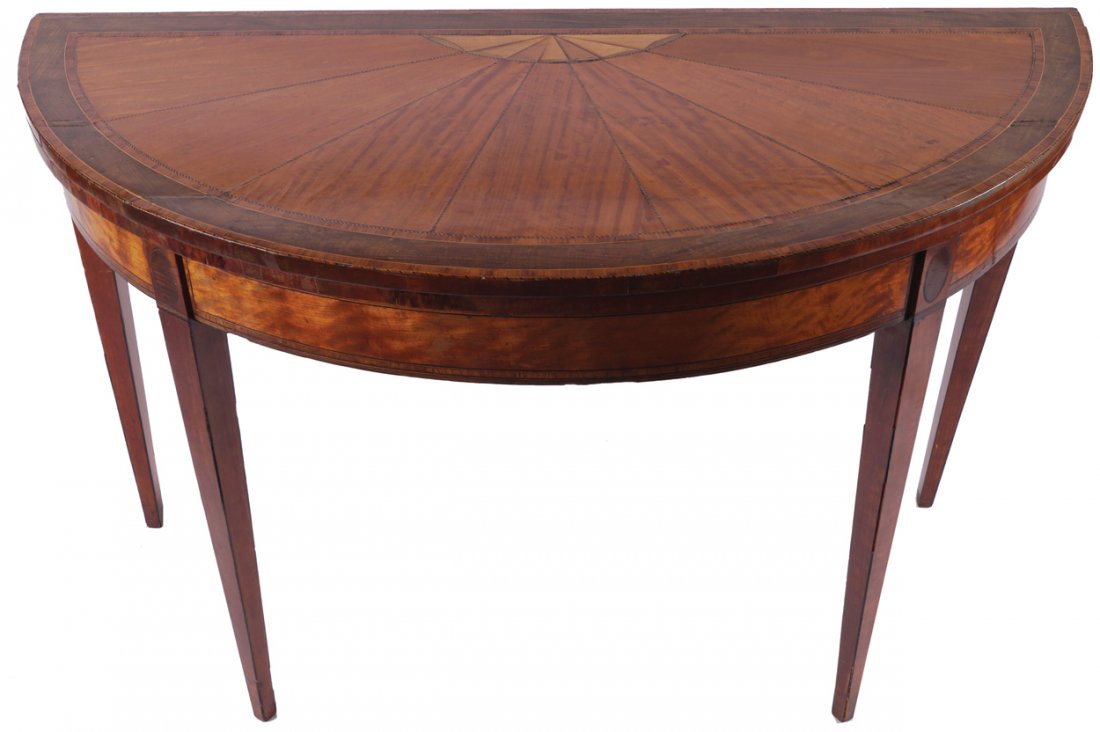 Large George III period satinwood and sycamore inlaid: Attributed to William Moore of Dublin the sunray segmented demi-lune shaped fold-over top, opening to a baize lined interior, above a conforming frieze, raised on square tapered legs Worldwide shippin