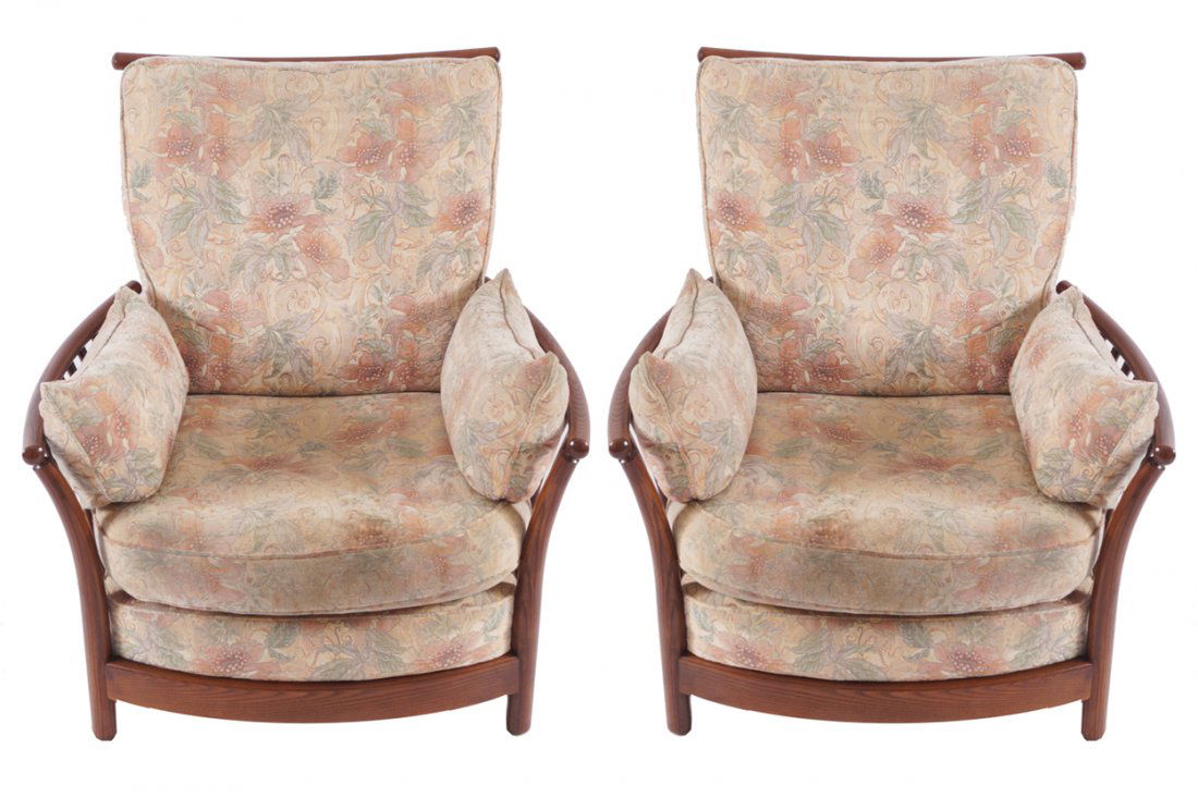 Pair of Ercol arm chairs: each with loose cushions Worldwide shipping available. All queries must be made to shipping@sheppards.ie prior to 29 February 2016.