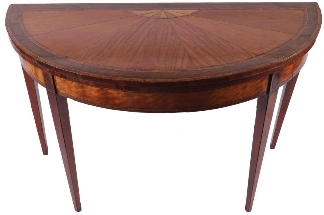 LARGE GEORGE III PERIOD SATINWOOD AND SYCAMORE INLAID: LARGE GEORGE III PERIOD SATINWOOD AND SYCAMORE INLAID CONSOLE TABLE, CIRCA 1790 Attributed to William Moore of Dublin The sunray segmented demi-lune shaped fold-over top, opening to a baize lined inte