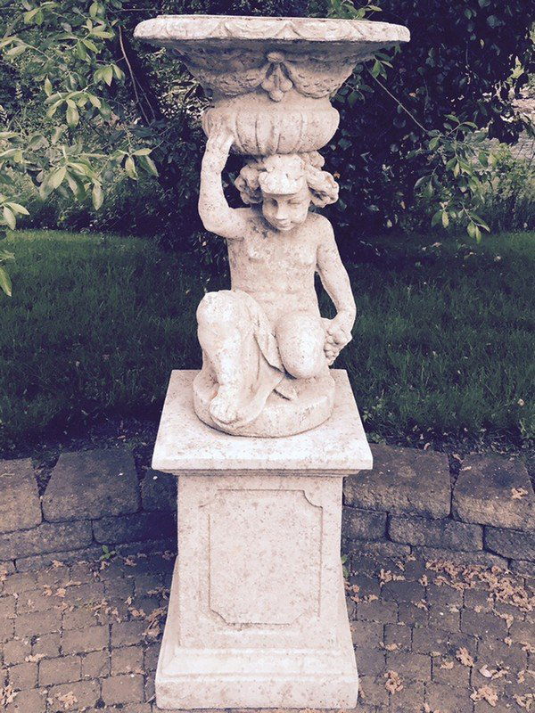 PAIR OF CAST-STONE CHERUB  SUPPORTED URNS (1 of 1)