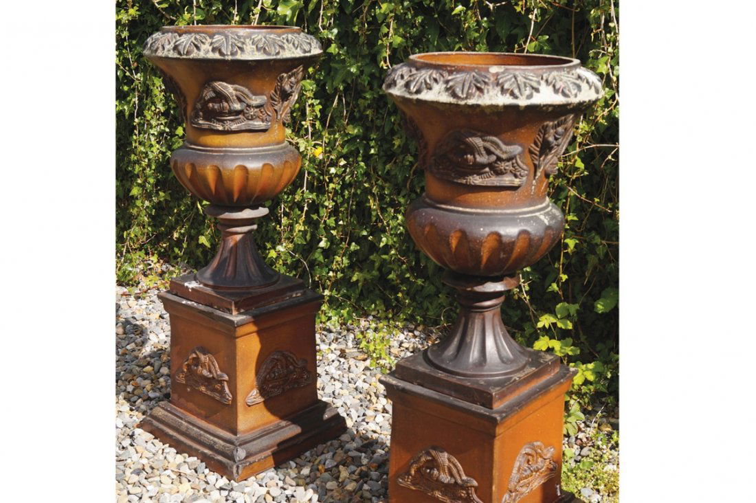 PAIR OF LARGE NINETEENTH-CENTURY CAMPANA SHAPED: PAIR OF LARGE NINETEENTH-CENTURY CAMPANA SHAPED TERRACOTTA URNS each with raised moulded leaf decoration supported on a square plinth. 100 cm. high (2) Worldwide shipping available. Contact shipping@s