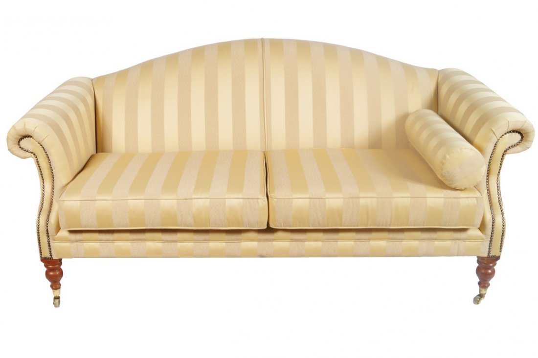 PAIR OF HUMP BACK SETTEES: PAIR OF HUMP BACK SETTEES each raised on turned legs to the fore, terminating on brass cup castors 95 cm. high; 200 cm. wide; 80 cm. deep (2) Worldwide shipping available. Contact shipping@sheppards.i