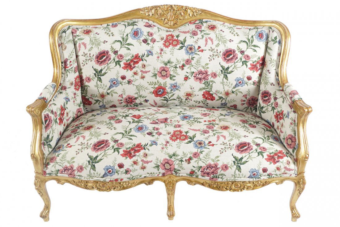 PAIR OF CARVED GILTWOOD LOUIS XV STYLE SETTEES: PAIR OF CARVED GILTWOOD LOUIS XV STYLE SETTEES each with a serpentine crest rail above an upholstered back and seat, raised on cabriole legs to the fore