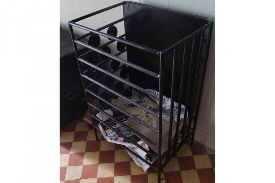 CAST-IRON LOG BASKET: CAST-IRON LOG BASKET of rectangular form Dimensions:60 cm. wide; 40 cm. deep; 90 cm. high