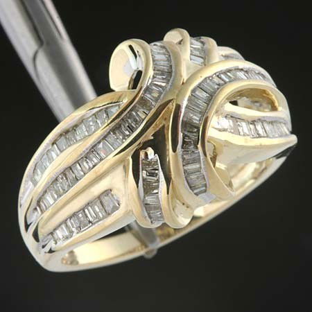 1.0 CTW. DIAMOND CHANNEL SET RING - 10KY GOLD: 1.0 CTW. OF BAGUETTE CUT DIAMONDS SET IN A FANCY 10KY GOLD SETTING
