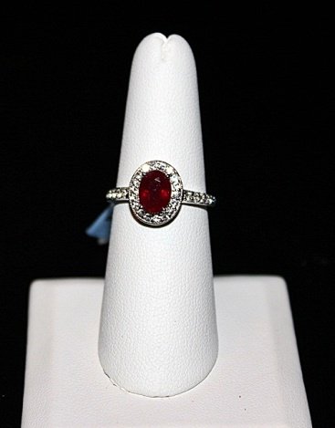 STERLING RING W/WHITE SAPPHIRE & RUBY: .925 STERLING SILVER RING WITH 30 WHITE SAPPHIRES AND 1 RUBY. WHITE SAPPHIRE: 0.54CTW RUBY: 1.63CTW .925 STERLING SILVER: 2.80G. RETAIL PRICE $696.00.