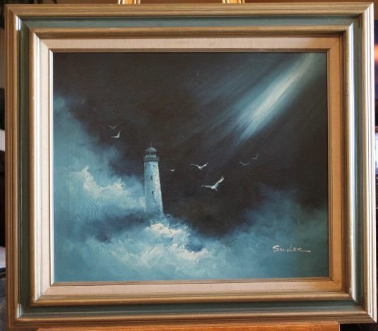 ORIGINAL OIL ON CANVAS: ORIGINAL HAND PAINTED OIL ON CANVAS - BY SANDLER - LIGHTHOUSE IN OCEAN SPRAY WITH GULLS - FRAMED 28" X 3.5"